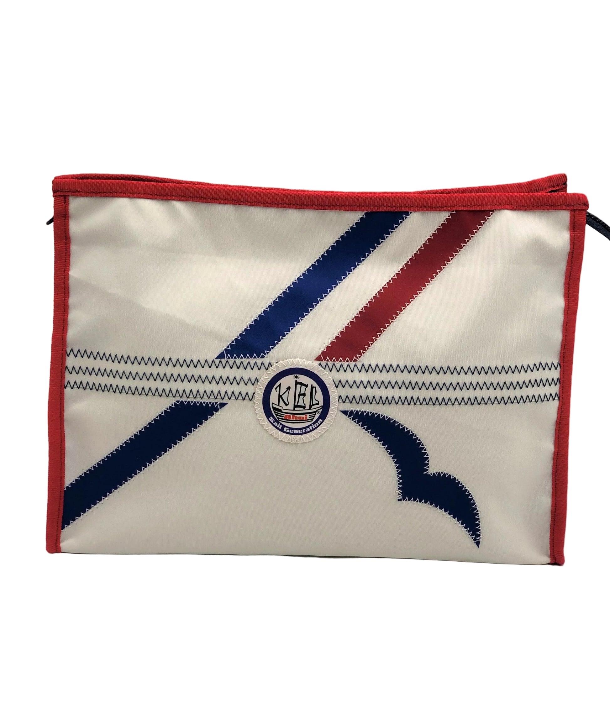 Kulturtasche aus Segeltuch in weiß mit Applikationen in rot und blau.